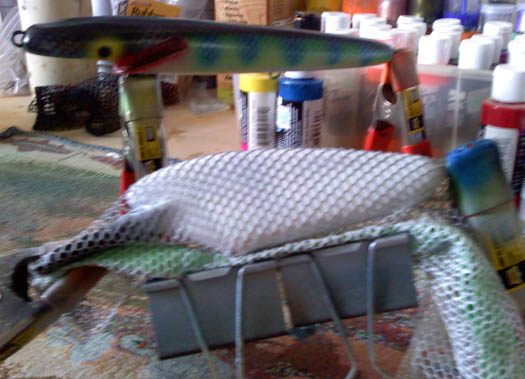 How to make your own custom scale stencil and paint a overly complicated  muskie lure with it. 